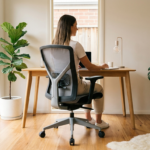 Person sitting with good posture in an ergonomic office chair in a bright Australian home office